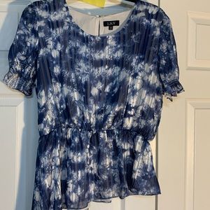 Ladies asymmetrical blouse. Dark blue and white print.